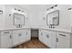 Bright bathroom with double vanity, white cabinets, quartz counters, and black hardware at 8517 Bayland Dr, Las Vegas, NV 89134