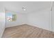 Bedroom with laminate flooring, white walls, and natural light at 8517 Bayland Dr, Las Vegas, NV 89134