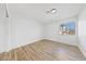 Bright bedroom with laminate floors, white walls, and natural light at 8517 Bayland Dr, Las Vegas, NV 89134