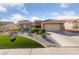 Charming single-story home with desert landscaping, a two-car garage, and a red tile roof at 8517 Bayland Dr, Las Vegas, NV 89134