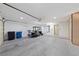 Spacious garage with epoxy flooring, room for two cars and a golf cart, plus built in cabinets for additional storage at 8517 Bayland Dr, Las Vegas, NV 89134