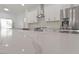 Close-up on a bright kitchen countertop with stainless steel appliances and stylish backsplash at 8517 Bayland Dr, Las Vegas, NV 89134