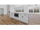 Bright kitchen boasts white cabinets, modern appliances, and a stylish breakfast bar at 8517 Bayland Dr, Las Vegas, NV 89134