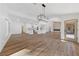 Spacious living room featuring an open floor plan, modern lighting, and wood-look flooring at 8517 Bayland Dr, Las Vegas, NV 89134