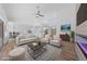 Open living area featuring lots of natural light, neutral furniture, and a cozy fireplace at 8517 Bayland Dr, Las Vegas, NV 89134