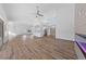 Open concept living room with high ceilings, wood floors, and lots of natural light from large windows at 8517 Bayland Dr, Las Vegas, NV 89134