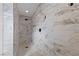 Modern shower with white and gray marble tile and black hardware at 8517 Bayland Dr, Las Vegas, NV 89134