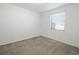 Simple bedroom with gray carpet and window with blinds at 9329 Forest Meadows Ave, Las Vegas, NV 89149