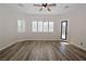 Living room with wood-look floors and plantation shutters at 5727 Golden Leaf Ave, Las Vegas, NV 89122