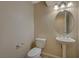 Well-lit bathroom with an oval mirror and a pedestal sink at 1305 Allegheny Moon Ter # 2, Henderson, NV 89002