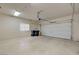 Spacious two-car garage with a window, and a light colored concrete floor at 1305 Allegheny Moon Ter # 2, Henderson, NV 89002