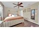 Main bedroom with king bed and ceiling fan at 6552 Roy Rogers Dr, Las Vegas, NV 89108