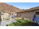 Backyard features artificial grass and a playhouse with mountain views at 868 Marina Dr, Boulder City, NV 89005