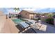 Backyard pool area features an in-ground pool, covered outdoor entertaining area, and lounge chairs for relaxing by the water at 868 Marina Dr, Boulder City, NV 89005
