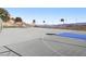 A basketball court with multiple hoops, perfect for recreational play with scenic mountain views in the background at 868 Marina Dr, Boulder City, NV 89005