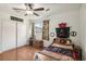 Bright, pirate-themed bedroom with wood floors, ceiling fan, and ample closet space at 868 Marina Dr, Boulder City, NV 89005