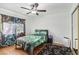 Gaming themed bedroom with ceiling fan, hardwood floors and modern decor at 868 Marina Dr, Boulder City, NV 89005