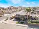 Charming two-story home with a balcony and lush landscaping at 868 Marina Dr, Boulder City, NV 89005