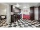 Garage with black-and-white checkerboard flooring and built-in storage cabinets at 868 Marina Dr, Boulder City, NV 89005