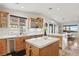 Bright kitchen boasts modern appliances, quartz countertops, and mountain views from the window at 868 Marina Dr, Boulder City, NV 89005