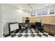 Well-lit office with dual desks, corkboard, and a black and white checkered floor design at 868 Marina Dr, Boulder City, NV 89005