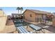 Sparkling pool with lounge chairs and covered patio is perfect for relaxation and entertainment at 868 Marina Dr, Boulder City, NV 89005