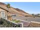 Great street view of home, adjacent mountain and low-water landscaping at 868 Marina Dr, Boulder City, NV 89005