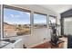 Breathtaking mountain and lake views through large windows, natural light with exercise equipment at 868 Marina Dr, Boulder City, NV 89005