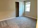 Well-lit bedroom with neutral walls and carpet at 9813 Belikove Manor Ave, Las Vegas, NV 89178