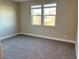 Spacious bedroom with neutral walls and carpet at 9813 Belikove Manor Ave, Las Vegas, NV 89178