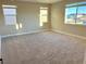 Bright bedroom with neutral walls and carpet at 9813 Belikove Manor Ave, Las Vegas, NV 89178