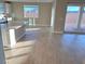 Bright dining area with wood-look floors and access to the backyard at 9813 Belikove Manor Ave, Las Vegas, NV 89178