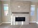 Living room with modern fireplace and wood mantel at 9813 Belikove Manor Ave, Las Vegas, NV 89178