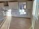 Modern kitchen with white cabinets and gas cooktop at 9813 Belikove Manor Ave, Las Vegas, NV 89178