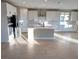 Kitchen with white cabinets, large island, and stainless steel appliances at 9813 Belikove Manor Ave, Las Vegas, NV 89178