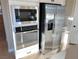 Stainless steel microwave, oven, and refrigerator at 9813 Belikove Manor Ave, Las Vegas, NV 89178