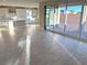 Open concept living area with kitchen and patio access at 9813 Belikove Manor Ave, Las Vegas, NV 89178