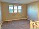 Spacious upstairs bedroom with neutral walls and carpet at 9813 Belikove Manor Ave, Las Vegas, NV 89178