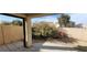 View of the backyard which includes a patio, desert landscaping, and a block fence at 1013 Adobe Flat Dr, Henderson, NV 89011