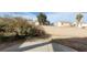 View of the backyard which includes desert landscaping and a block fence at 1013 Adobe Flat Dr, Henderson, NV 89011