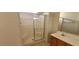 The bathroom has a shower with glass doors and a small vanity at 1013 Adobe Flat Dr, Henderson, NV 89011