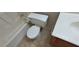 A bathroom with a neutral colored toilet and linoleum floor at 1013 Adobe Flat Dr, Henderson, NV 89011