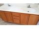The bathroom vanity has two sinks, lots of cabinets, and a neutral countertop at 1013 Adobe Flat Dr, Henderson, NV 89011