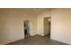 Simple bedroom with wood-look floors and an ensuite bathroom at 1013 Adobe Flat Dr, Henderson, NV 89011