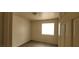 Small bedroom with wood-look floors and a window at 1013 Adobe Flat Dr, Henderson, NV 89011