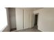 This bedroom features a closet with sliding doors and access to the rest of the home at 1013 Adobe Flat Dr, Henderson, NV 89011