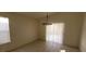 Dining room with updated light fixture and sliding glass door at 1013 Adobe Flat Dr, Henderson, NV 89011