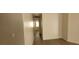 A bright hallway shows light wood laminate floors and freshly painted walls at 1013 Adobe Flat Dr, Henderson, NV 89011