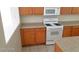 A kitchen featuring an oven and wooden cabinets at 1013 Adobe Flat Dr, Henderson, NV 89011