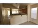 Open kitchen with breakfast bar and view to the backyard at 1013 Adobe Flat Dr, Henderson, NV 89011